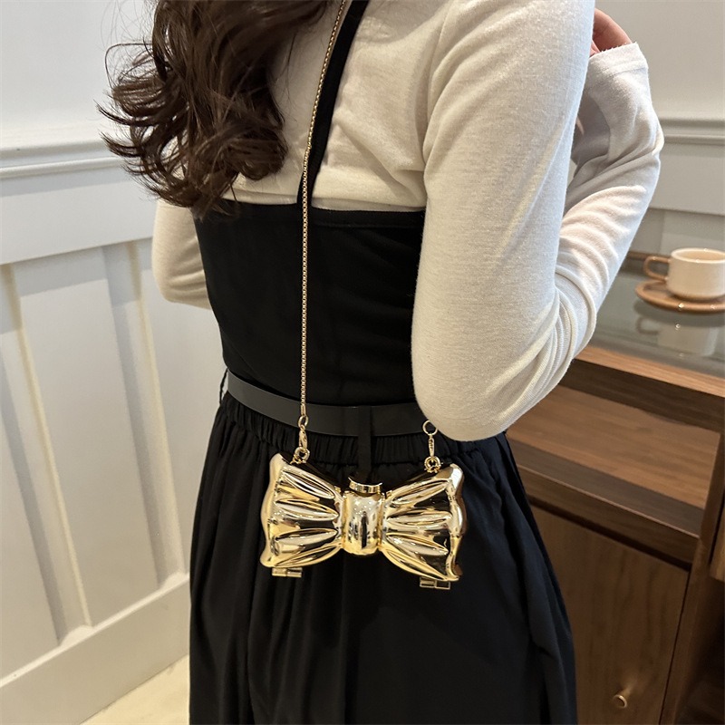 Glanzende gouden metalen strik - Luxury Bags Mini recensie en prijs
